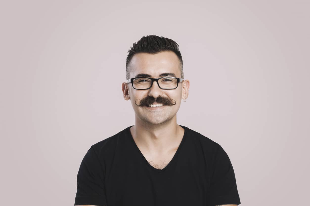 Smiling young man with mustache